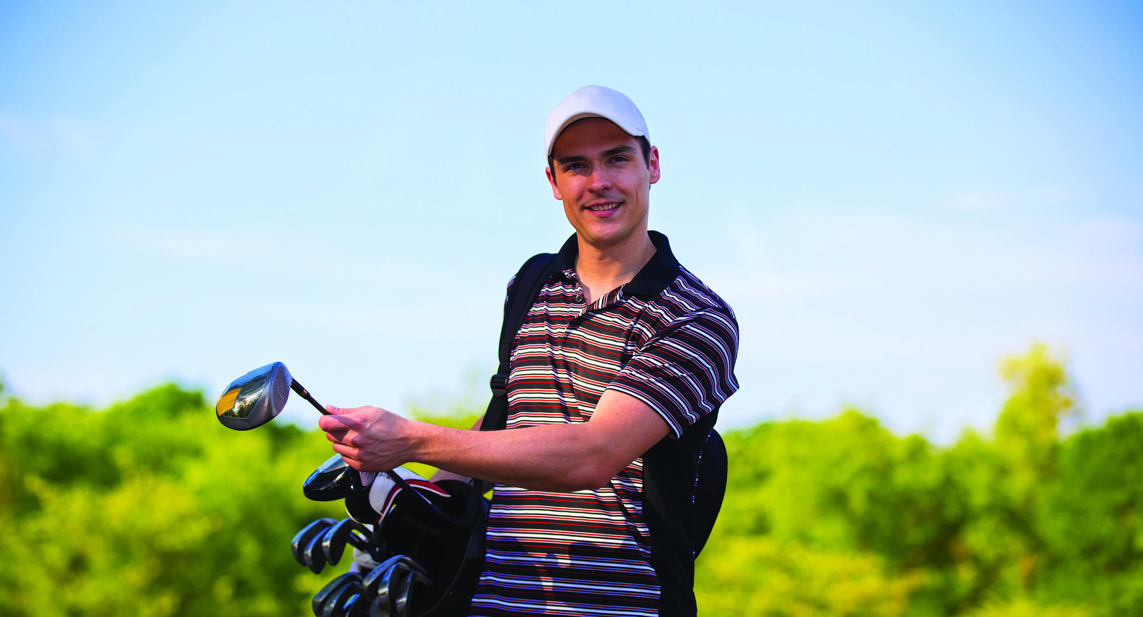 close-up of male golfer smiling for portrait