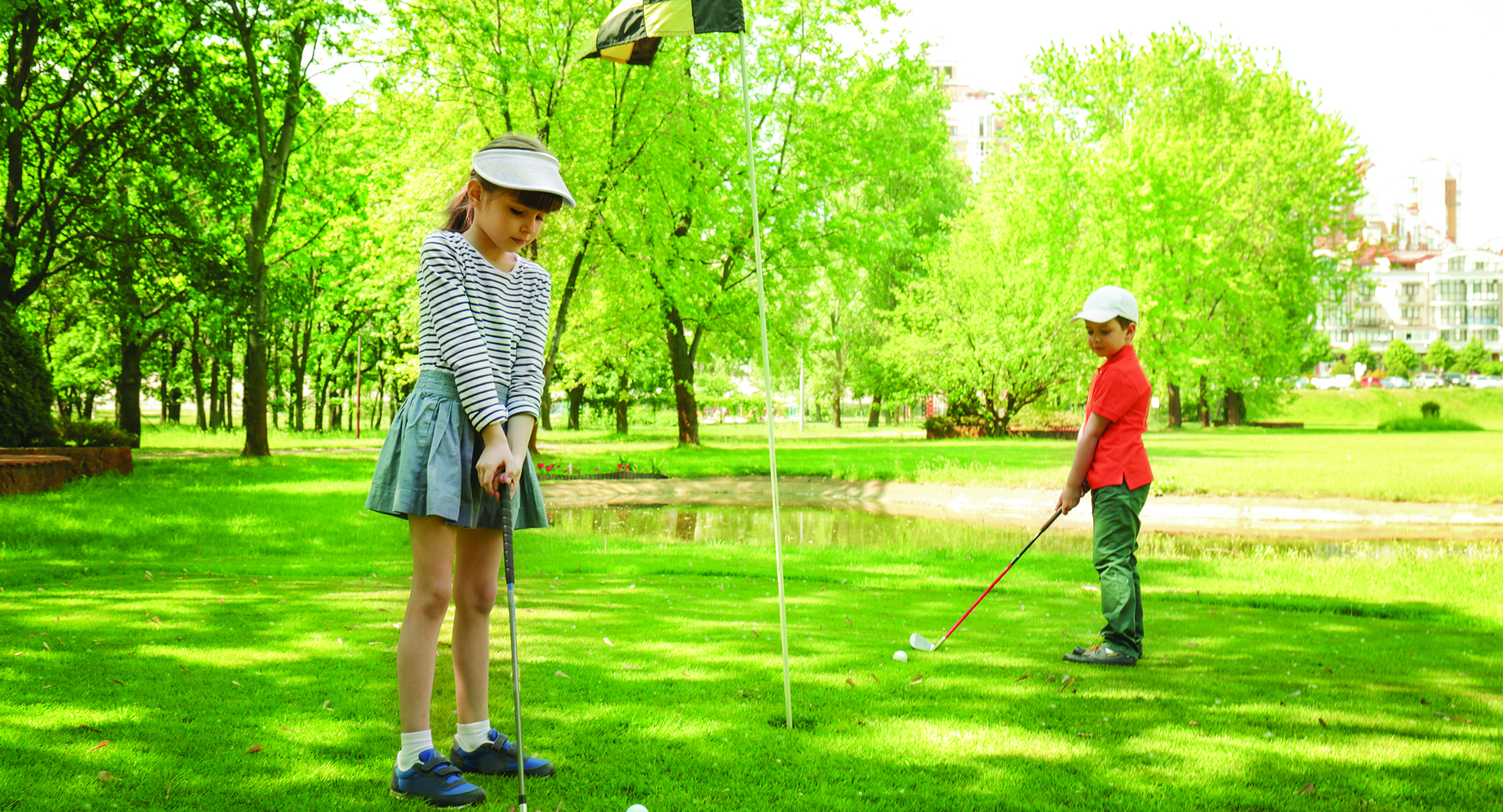 two kids golfing